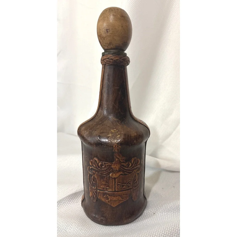 Vintage Leather Wrapped Decanter Bottle Embossed Coat of Arms Crest Wood Stopper
